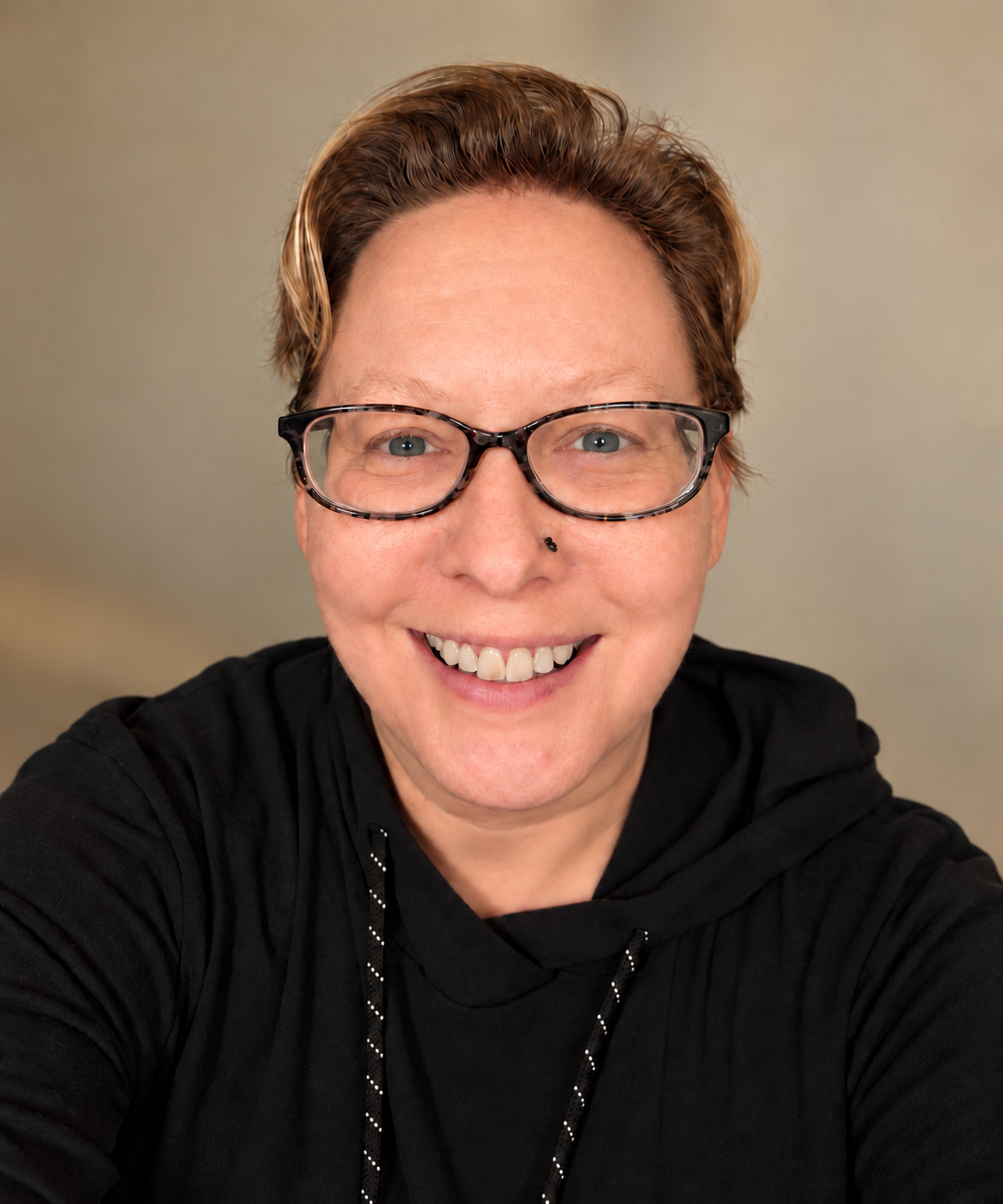 Cindy Price, Energy Healer and Reiki Master, smiling and wearing glasses